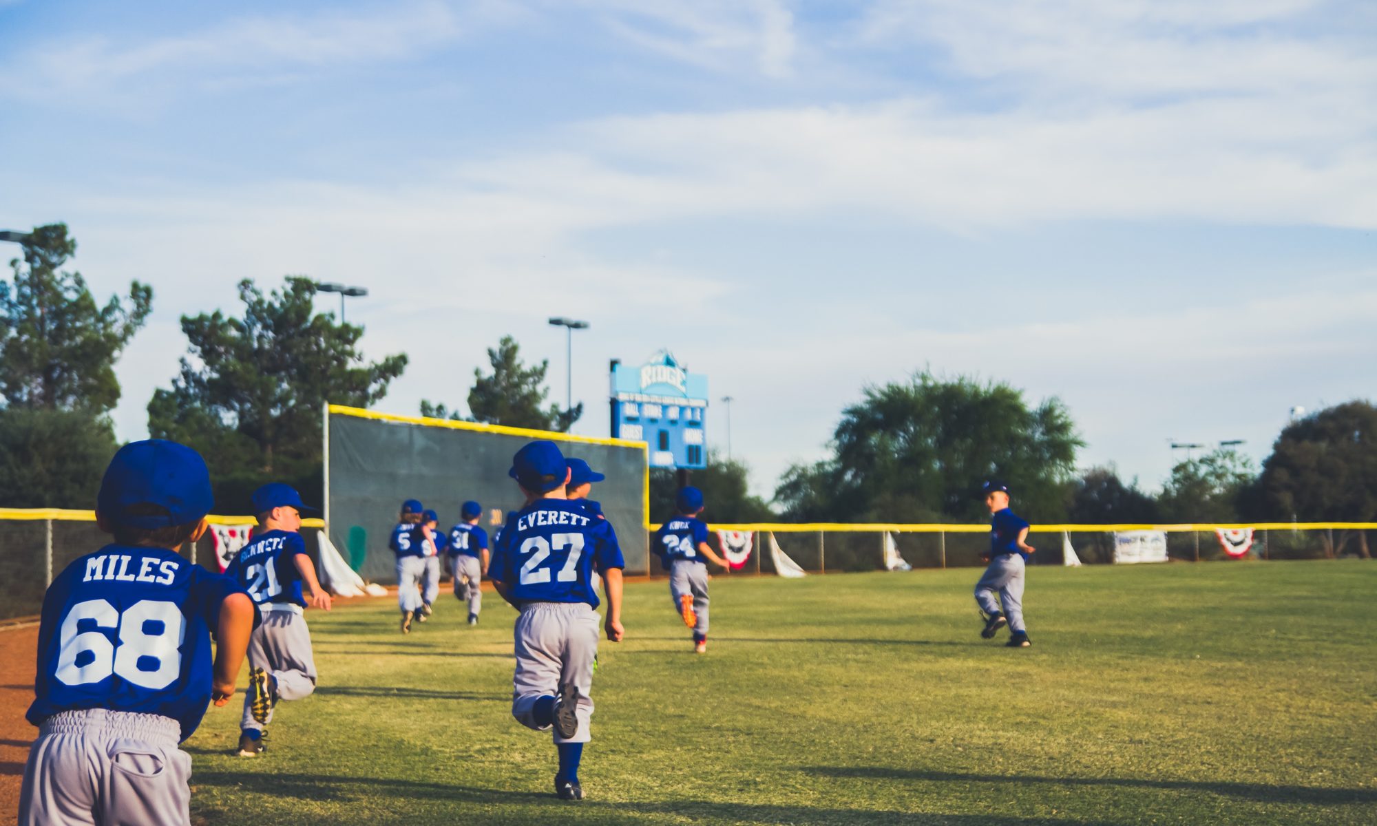 Photo by NeONBRAND on Unsplash of little league game